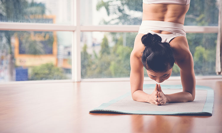woman doing yoga inversions